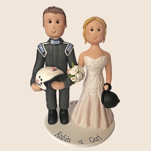 Wedding cake topper of racing driver with helmet